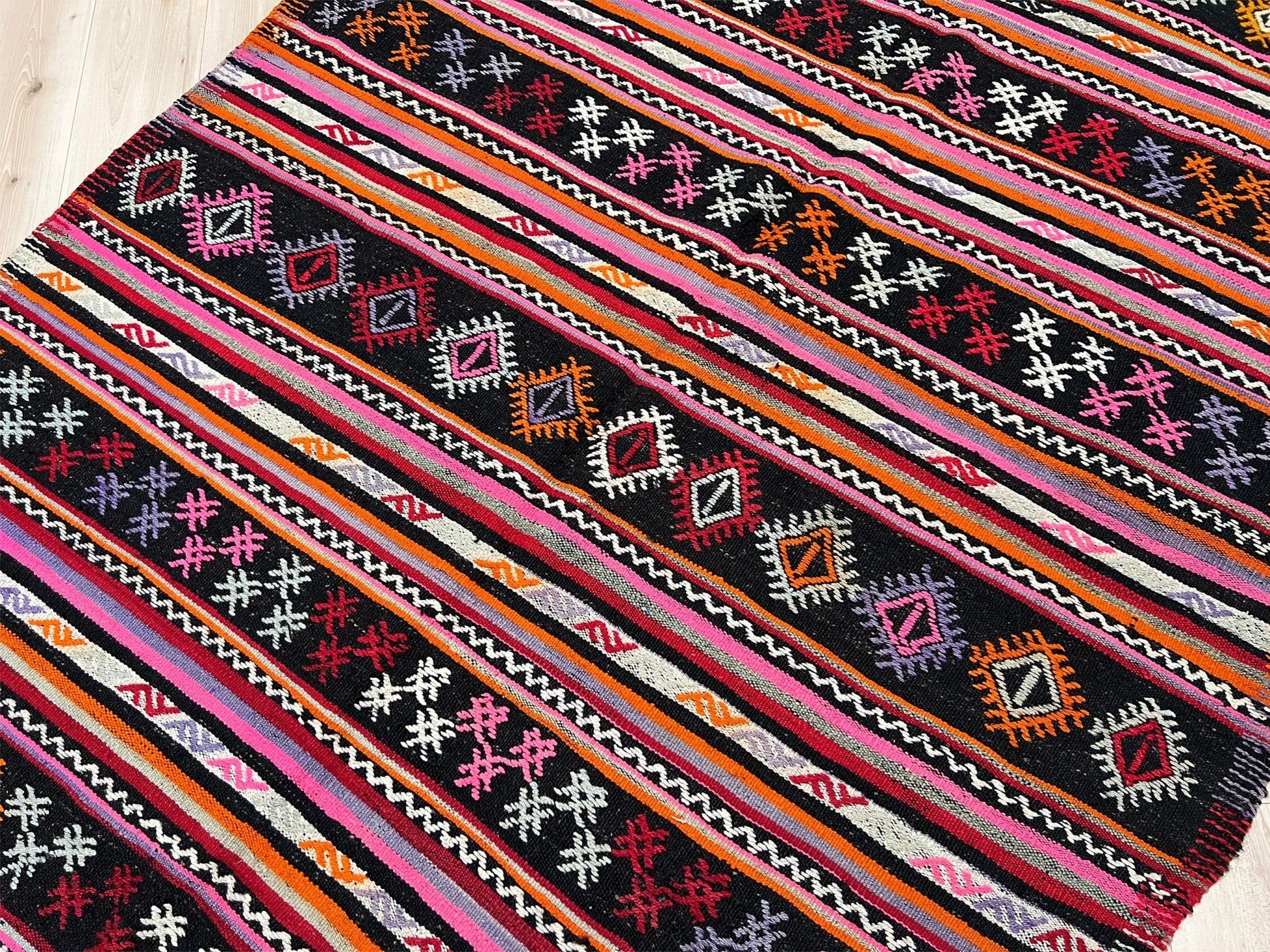 Pink striped Turkish kilim rug shop berkeley. Handmade rug San Francisco bay area. Vibrant color handmade wool rug. 