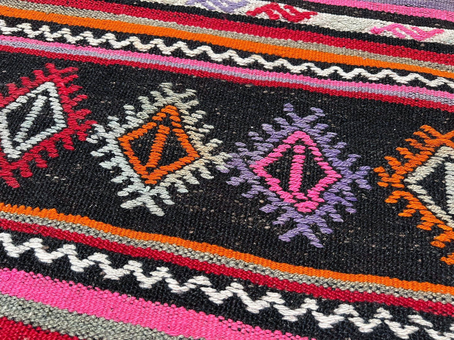 Pink striped Turkish kilim rug shop berkeley. Handmade rug San Francisco bay area. Vibrant color handmade wool rug. 