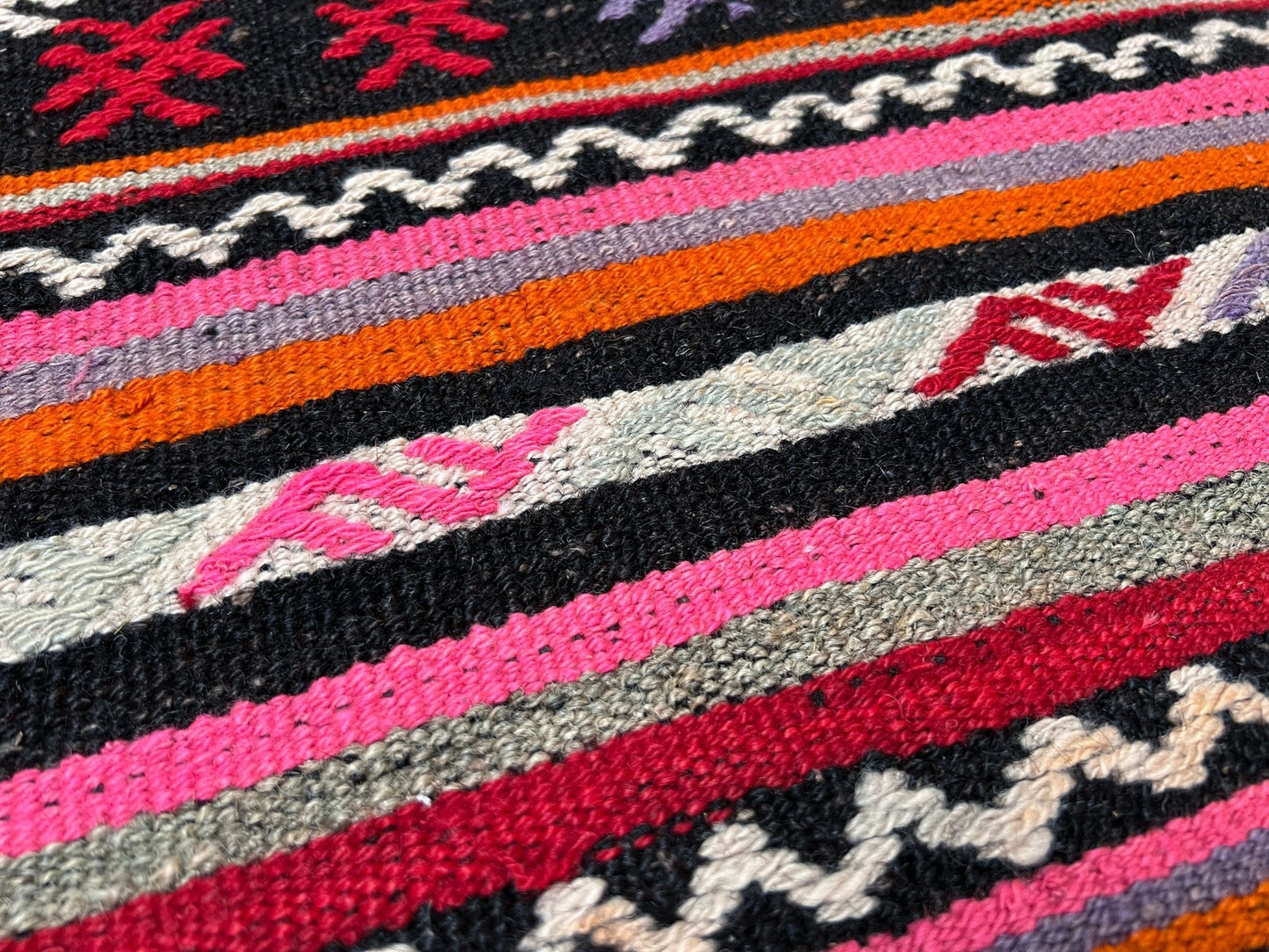 Pink striped Turkish kilim rug shop berkeley. Handmade rug San Francisco bay area. Vibrant color handmade wool rug. 