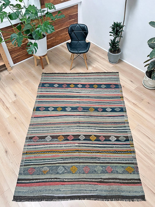vintage turkish kilim rug in living room setting, bright colors, indigo rugs, soft rug, bold color, San Francisco Bay Area, California, rug store, rug shop, local shop, vintage rug, modern kilim, warm colors, antique rug, antique kilim.
