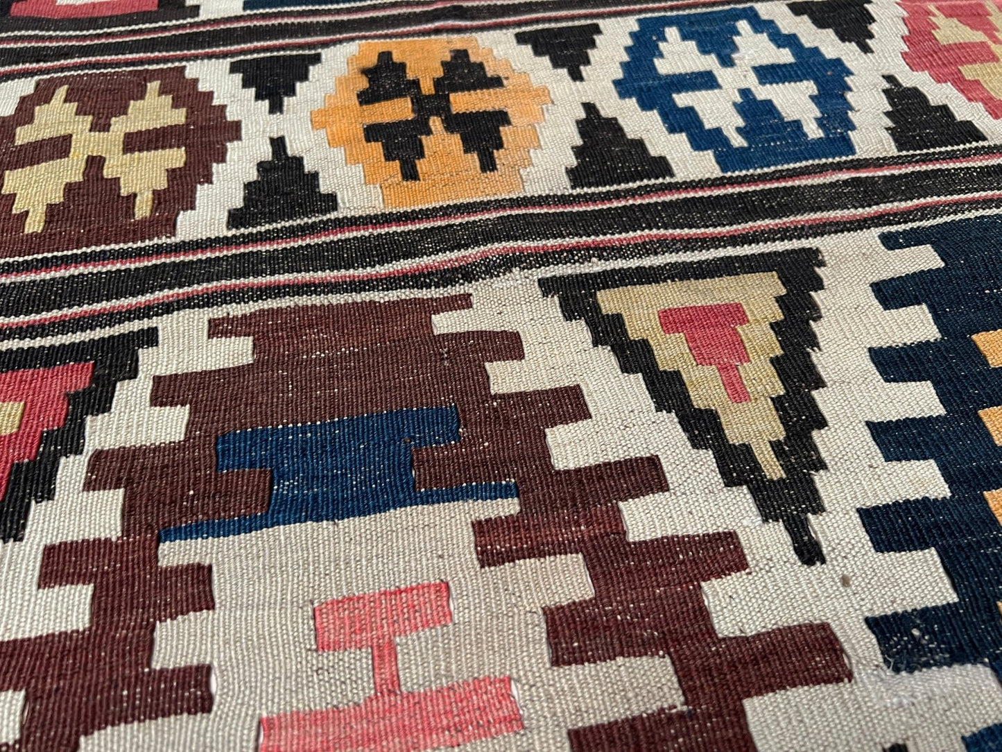 Kazak caucasian tribal kilim rug with vibrant rug. Handmade in living room setting. Flatweave rug shop Bay Area SF, California.  Wool rug for nursery Bright colors, bold color, rug store, rug shop  Palo Alto, berkeley, vintage rug, modern kilim, warm colors, antique rug.