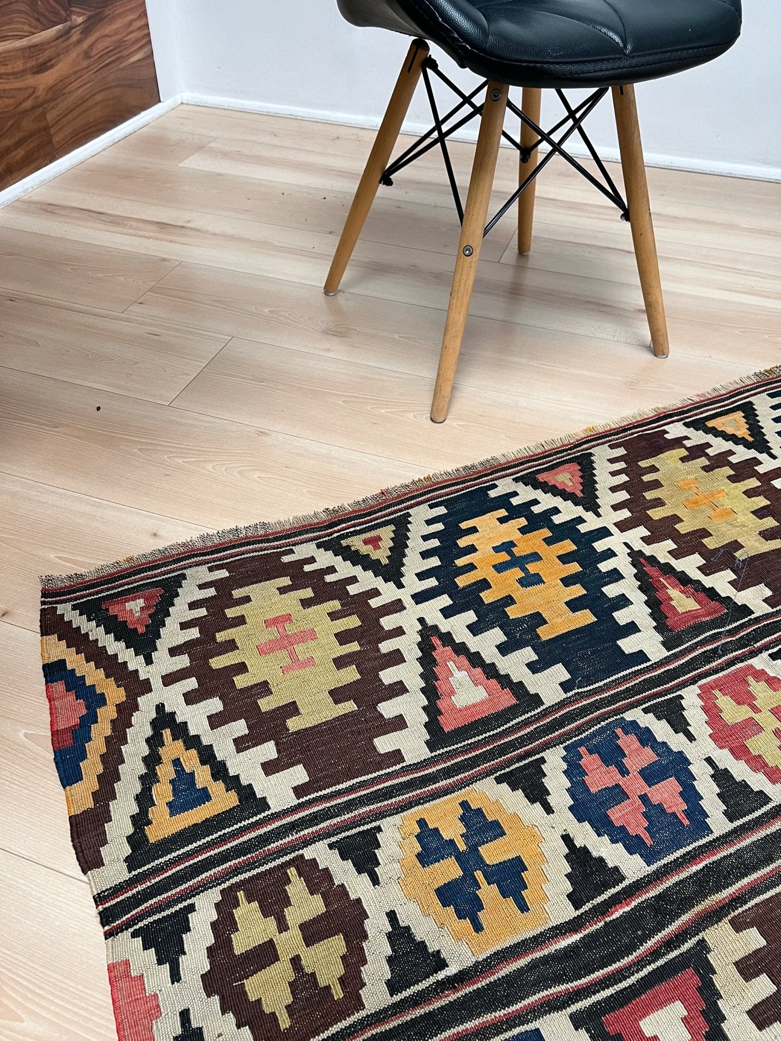 Kazak caucasian tribal kilim rug with vibrant rug. Handmade in living room setting. Flatweave rug shop Bay Area SF, California.  Wool rug for nursery Bright colors, bold color, rug store, rug shop  Palo Alto, berkeley, vintage rug, modern kilim, warm colors, antique rug.