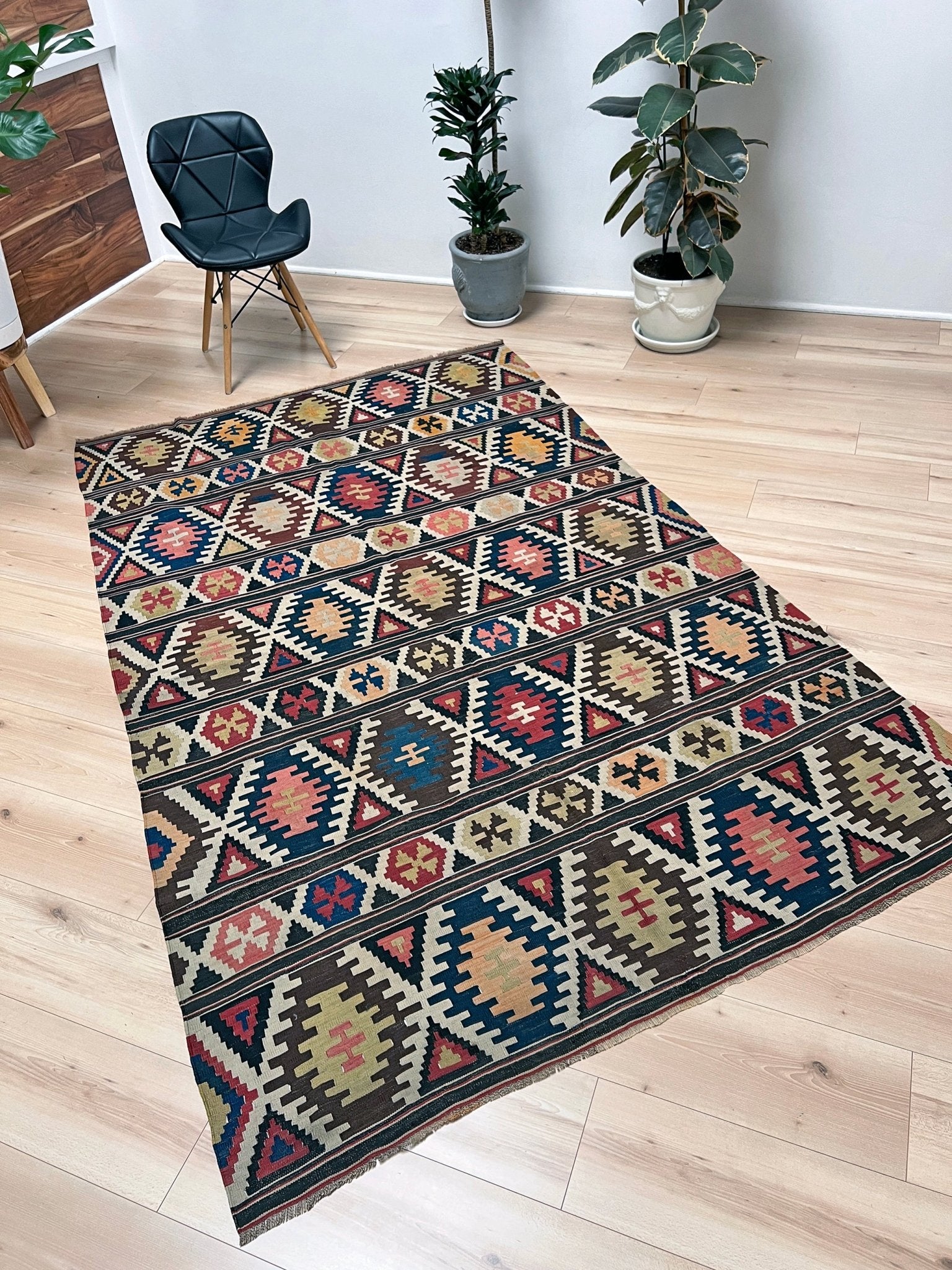 Kazak caucasian tribal kilim rug with vibrant rug. Handmade in living room setting. Flatweave rug shop Bay Area SF, California.  Wool rug for nursery Bright colors, bold color, rug store, rug shop  Palo Alto, berkeley, vintage rug, modern kilim, warm colors, antique rug.