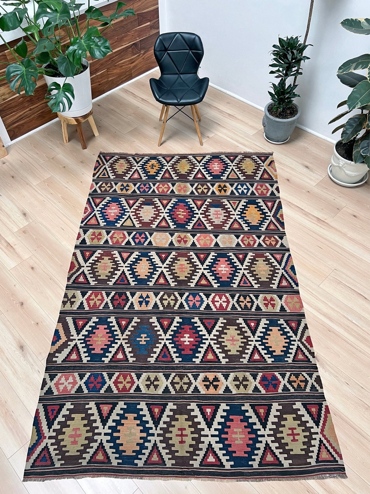 Kazak caucasian tribal kilim rug with vibrant rug. Handmade in living room setting. Flatweave rug shop Bay Area SF, California.  Wool rug for nursery Bright colors, bold color, rug store, rug shop  Palo Alto, berkeley, vintage rug, modern kilim, warm colors, antique rug.