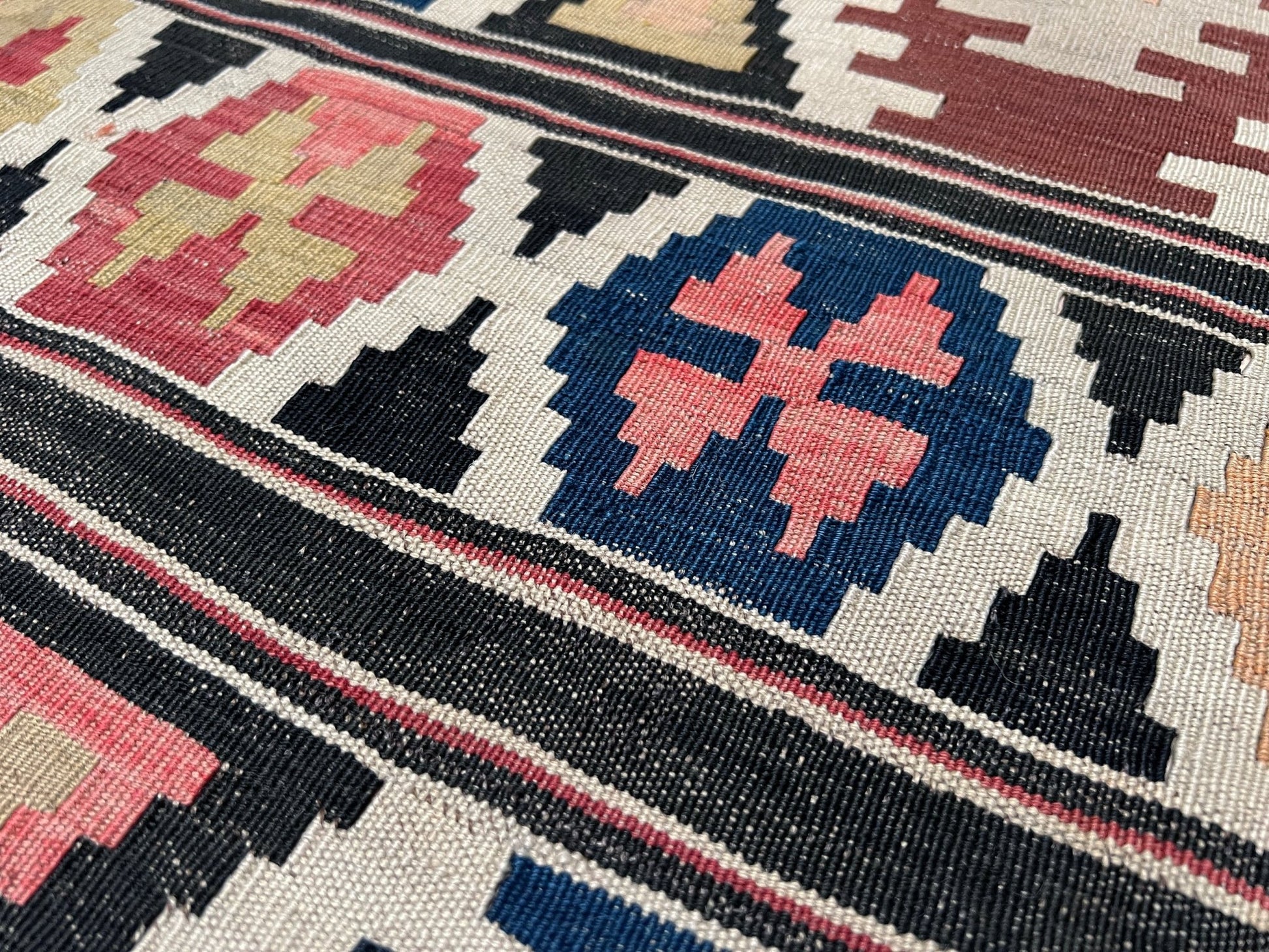 Kazak caucasian tribal kilim rug with vibrant rug. Handmade in living room setting. Flatweave rug shop Bay Area SF, California.  Wool rug for nursery Bright colors, bold color, rug store, rug shop  Palo Alto, berkeley, vintage rug, modern kilim, warm colors, antique rug.