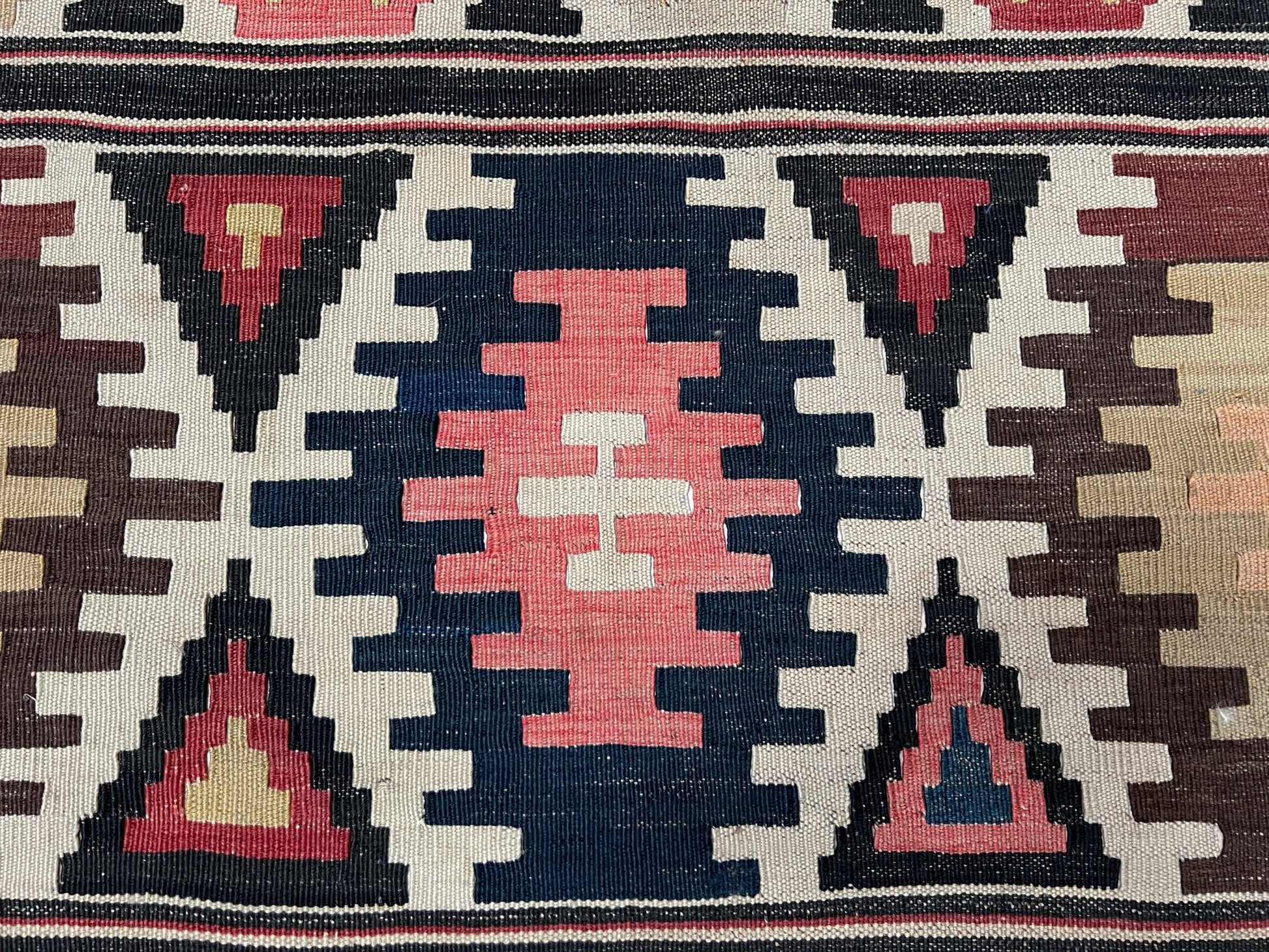 Kazak caucasian tribal kilim rug with vibrant rug. Handmade in living room setting. Flatweave rug shop Bay Area SF, California.  Wool rug for nursery Bright colors, bold color, rug store, rug shop  Palo Alto, berkeley, vintage rug, modern kilim, warm colors, antique rug.