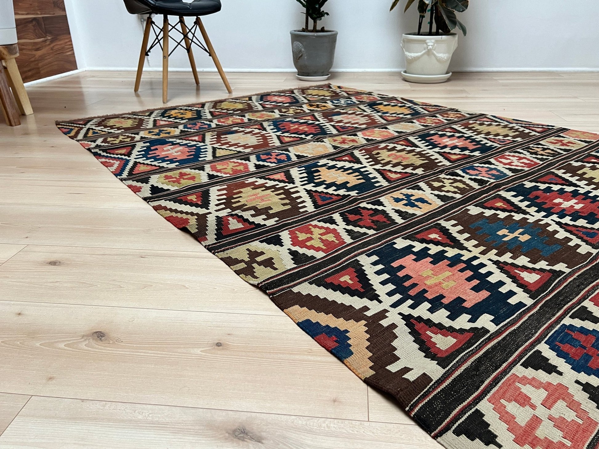 Kazak caucasian tribal kilim rug with vibrant rug. Handmade in living room setting. Flatweave rug shop Bay Area SF, California.  Wool rug for nursery Bright colors, bold color, rug store, rug shop  Palo Alto, berkeley, vintage rug, modern kilim, warm colors, antique rug.