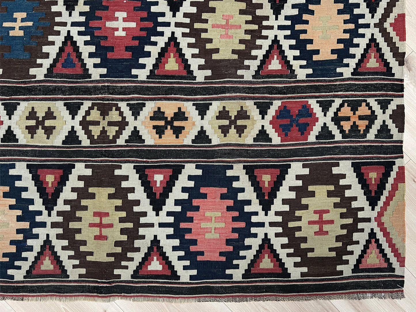 Kazak caucasian tribal kilim rug with vibrant rug. Handmade in living room setting. Flatweave rug shop Bay Area SF, California.  Wool rug for nursery Bright colors, bold color, rug store, rug shop  Palo Alto, berkeley, vintage rug, modern kilim, warm colors, antique rug.