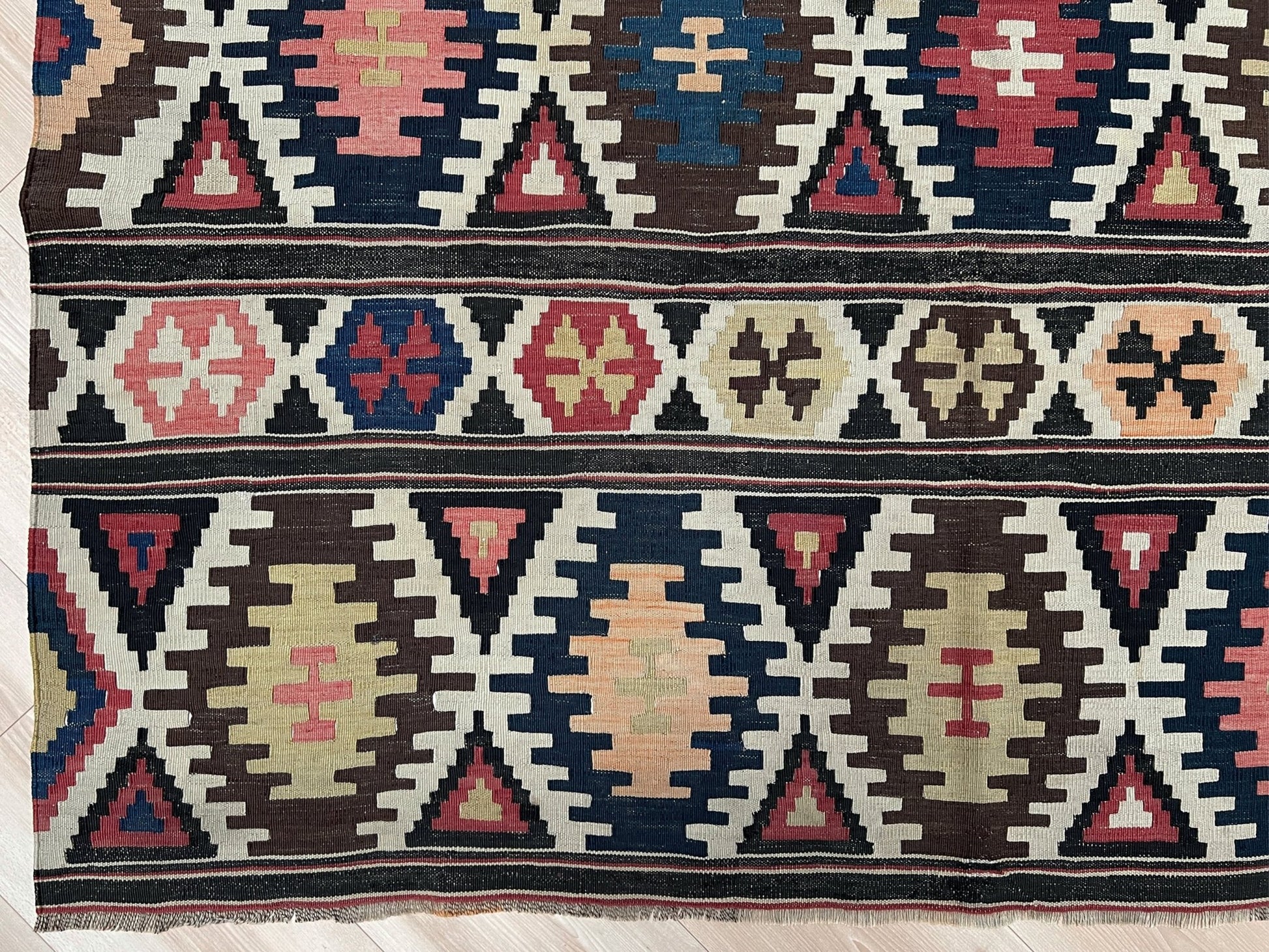 Kazak caucasian tribal kilim rug with vibrant rug. Handmade in living room setting. Flatweave rug shop Bay Area SF, California.  Wool rug for nursery Bright colors, bold color, rug store, rug shop  Palo Alto, berkeley, vintage rug, modern kilim, warm colors, antique rug.