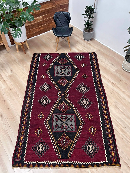 kayseri vintage turkish rug shop Sf Bay Area. Buy handmade wool flatweave rug. Vibrant color warm color rug in living room setting. 