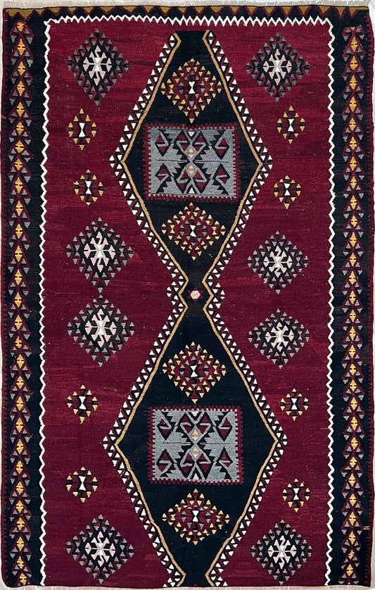 5x8 kayseri vintage turkish rug shop Sf Bay Area. Buy handmade wool flatweave rug. Vibrant color warm color rug in living room setting. 